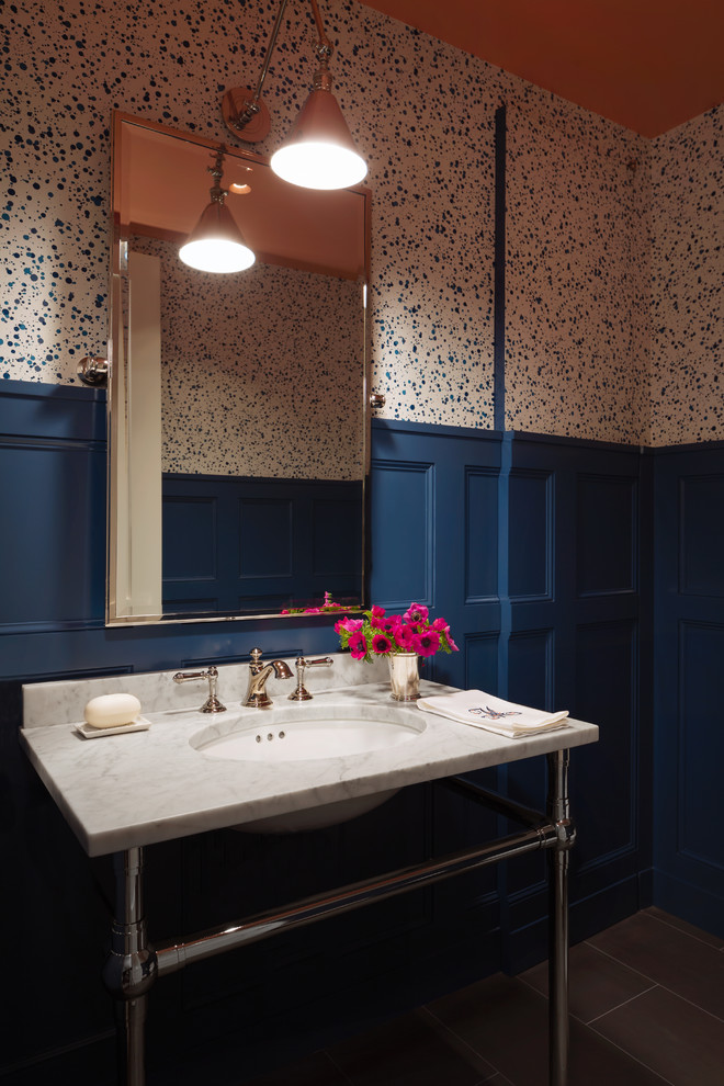 Design ideas for a mid-sized traditional powder room in New York with multi-coloured walls and a console sink.