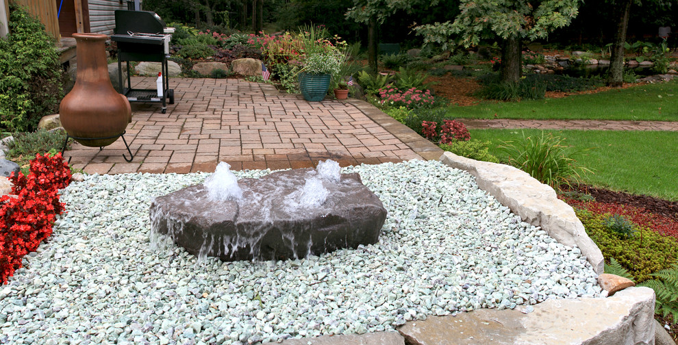 Inspiration for a contemporary garden in Detroit with a water feature.