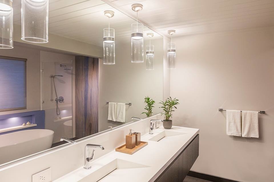 Large midcentury master bathroom in San Francisco with flat-panel cabinets, dark wood cabinets, a freestanding tub, a curbless shower, gray tile, porcelain tile, grey walls, porcelain floors, an integrated sink and engineered quartz benchtops.