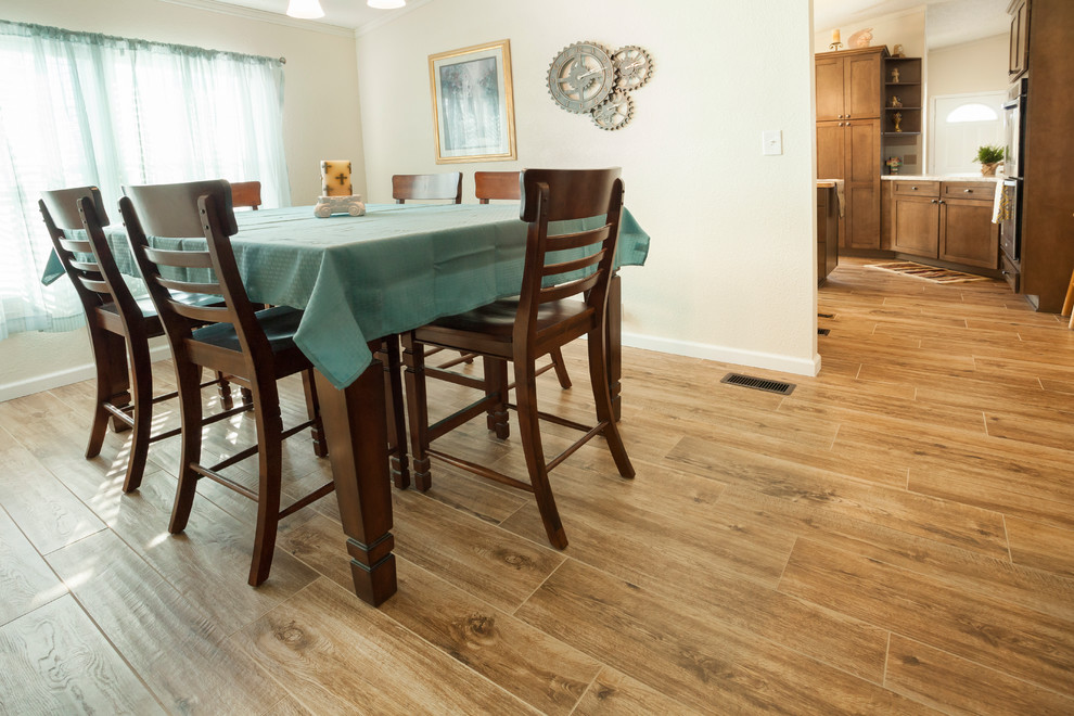 Inspiration for a mid-sized transitional kitchen/dining combo in Dallas with porcelain floors.