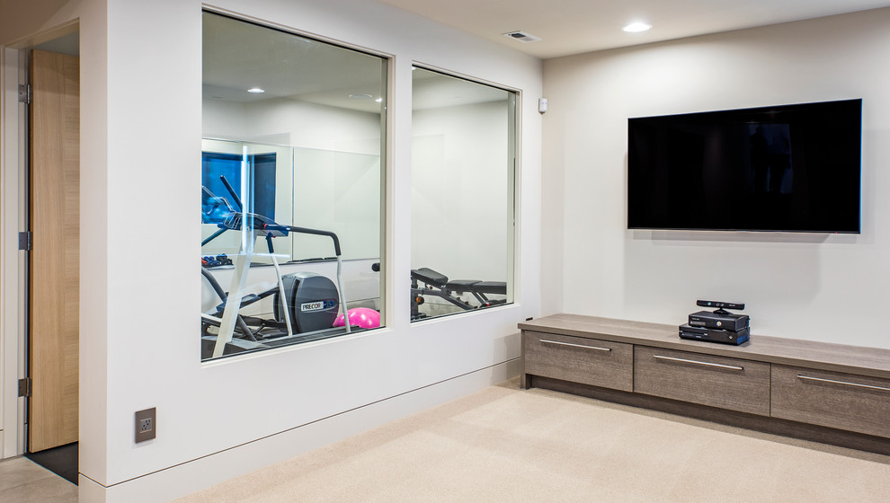 Mid-sized contemporary multipurpose gym in Seattle with beige walls and carpet.
