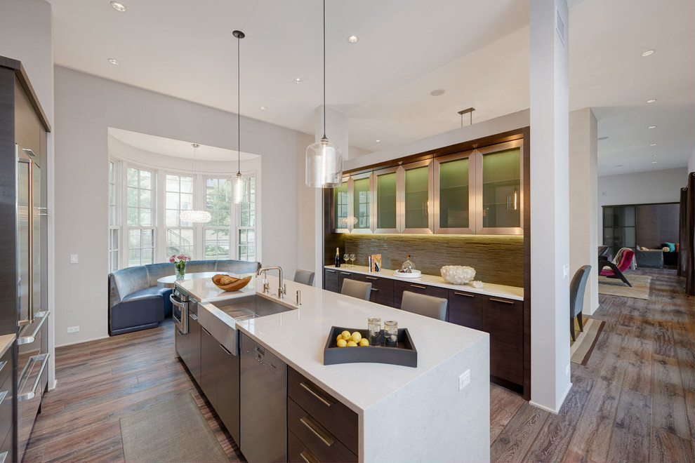 Photo of a contemporary kitchen in Chicago with a farmhouse sink, glass-front cabinets, dark wood cabinets, stainless steel appliances and dark hardwood floors.