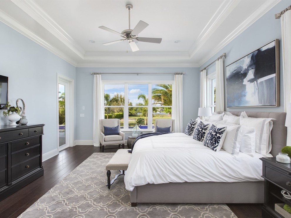 Inspiration for a large transitional master bedroom in Orlando with dark hardwood floors, blue walls and no fireplace.
