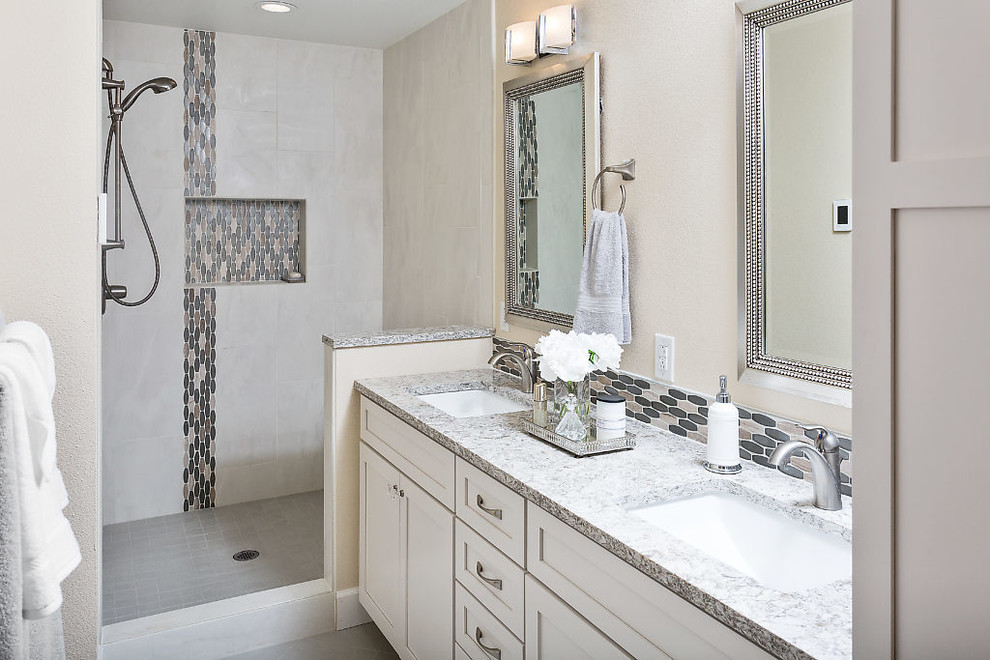 Transitional bathroom photo with shaker cabinets, white cabinets, beige walls, an undermount sink and quartz countertops