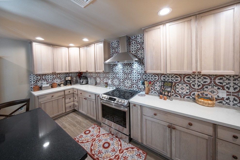 Mid-sized transitional u-shaped open plan kitchen in Phoenix with with island.