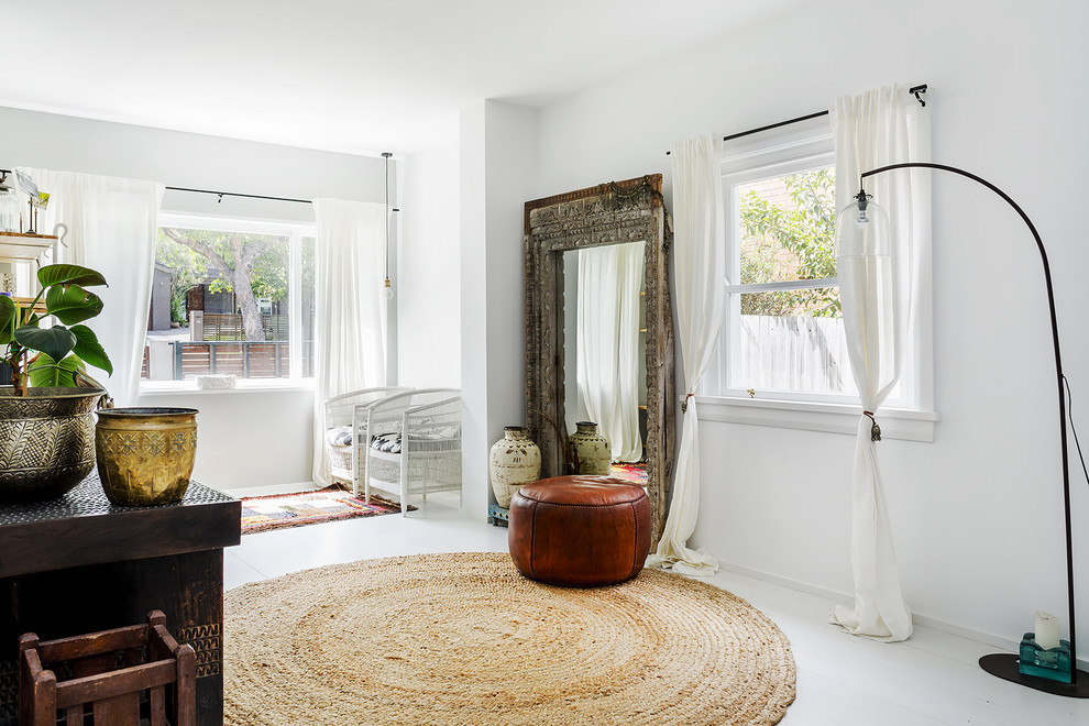 This is an example of a mid-sized scandinavian sunroom in Sydney with painted wood floors and a standard ceiling.