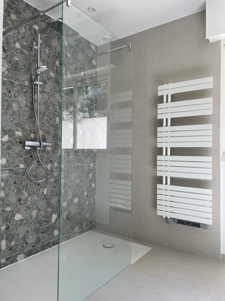 Example of a small minimalist 3/4 gray tile and ceramic tile ceramic tile, gray floor and double-sink walk-in shower design in Other with flat-panel cabinets, green cabinets, a one-piece toilet, white walls, a console sink, wood countertops, green countertops and a floating vanity