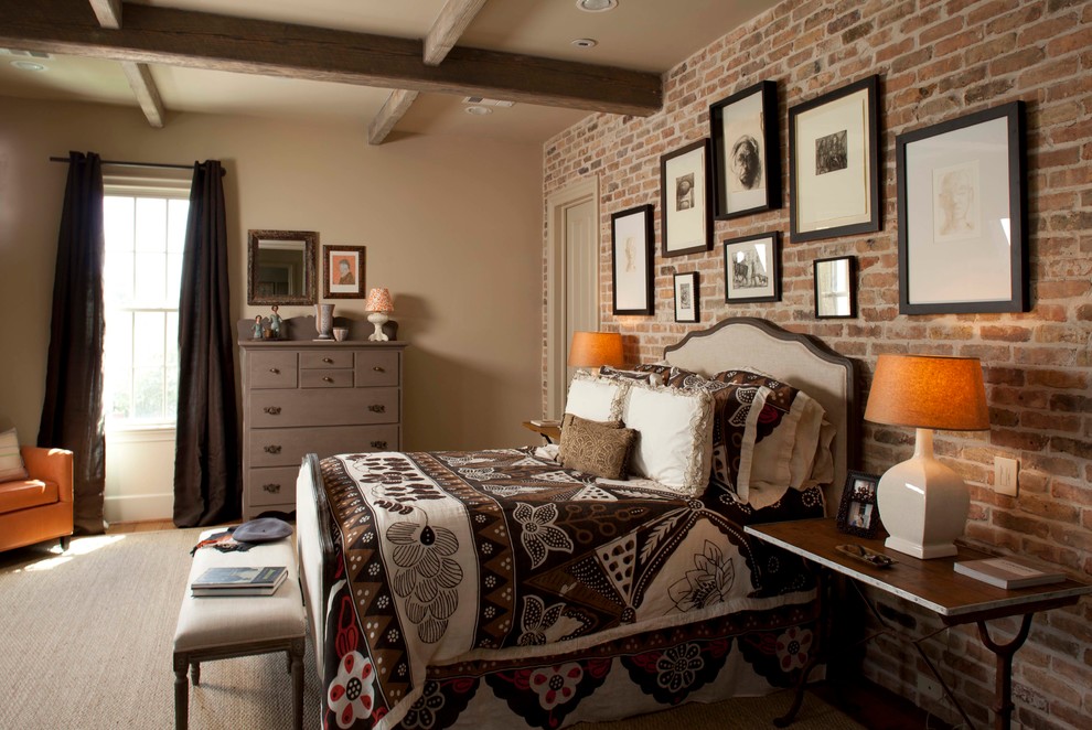 Design ideas for an expansive traditional master bedroom in Houston with beige walls, exposed beam and brick walls.
