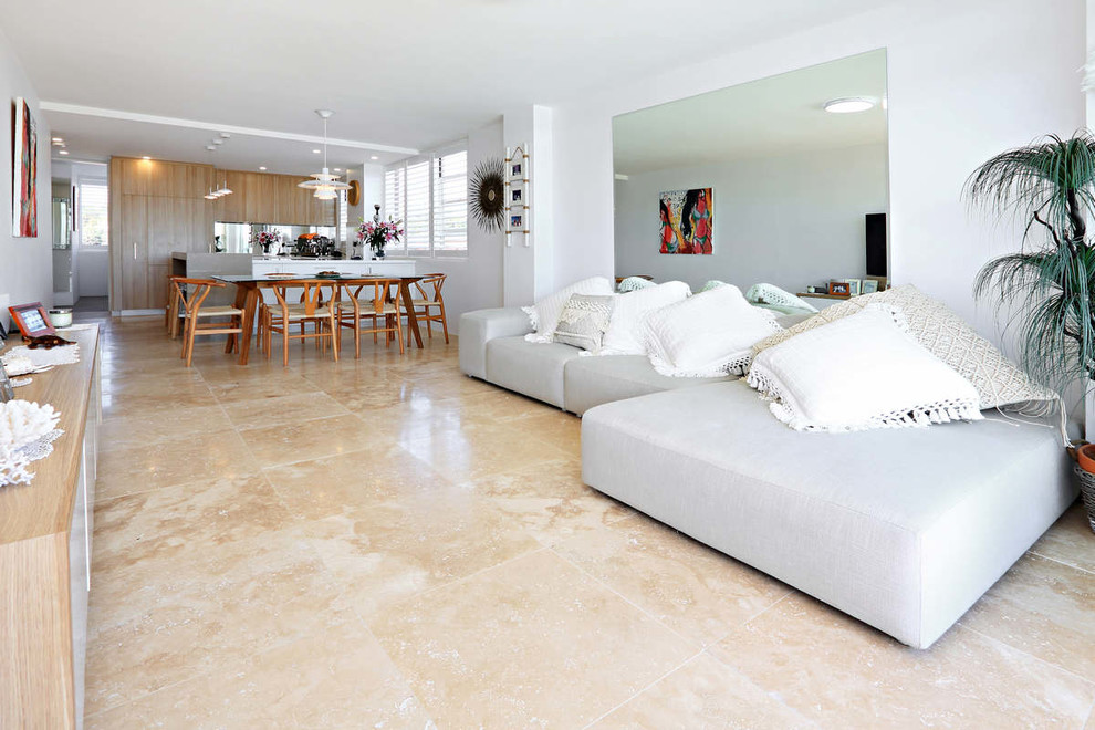 Photo of a small contemporary open concept living room in Sydney with travertine floors.