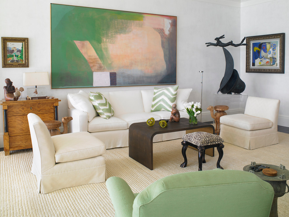 Example of a transitional formal living room design in Miami with white walls