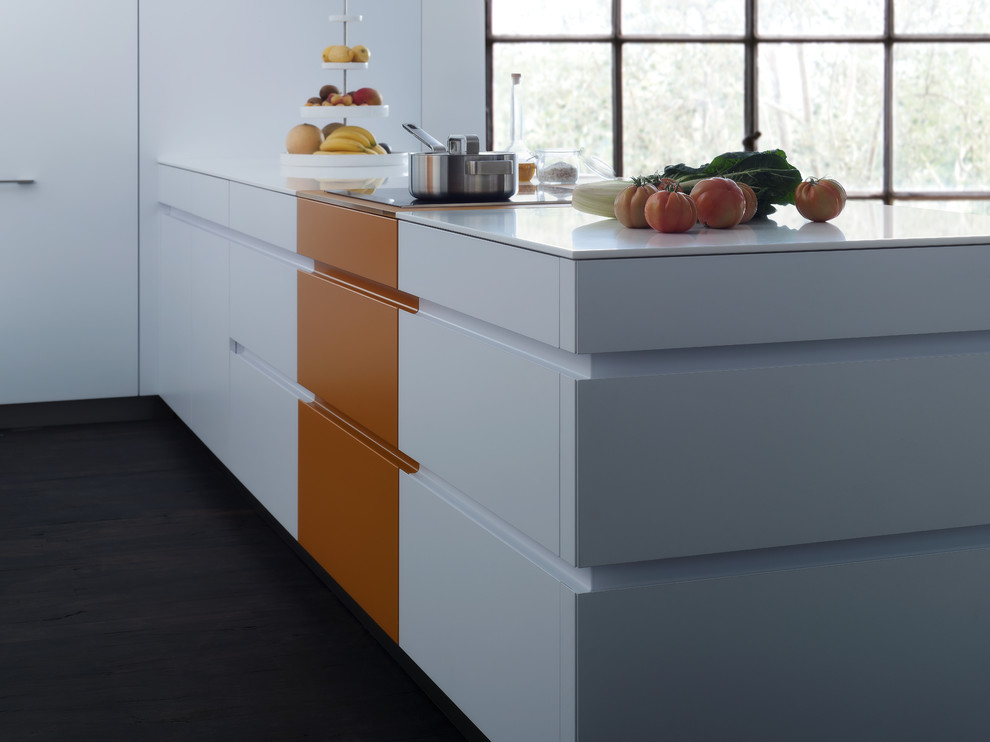 Large u-shaped eat-in kitchen in Orange County with an undermount sink, flat-panel cabinets, orange cabinets, quartz benchtops, white splashback, panelled appliances and dark hardwood floors.
