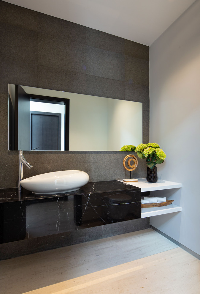 Contemporary bathroom in Miami with gray tile, grey walls, a vessel sink, beige floor and brown benchtops.