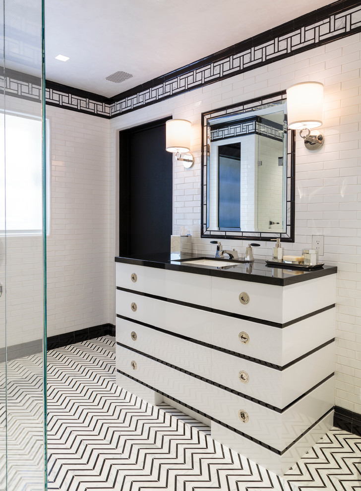 Photo of a transitional master bathroom in Los Angeles with an undermount sink, multi-coloured tile and flat-panel cabinets.