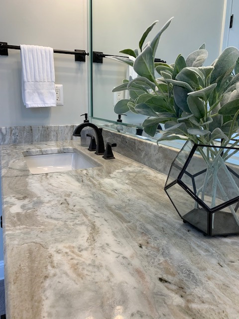 Inspiration for a mid-sized transitional master white tile porcelain tile, white floor and double-sink freestanding bathtub remodel with recessed-panel cabinets, white cabinets, a two-piece toilet, gray walls, an undermount sink, granite countertops, a hinged shower door, beige countertops and a built-in vanity