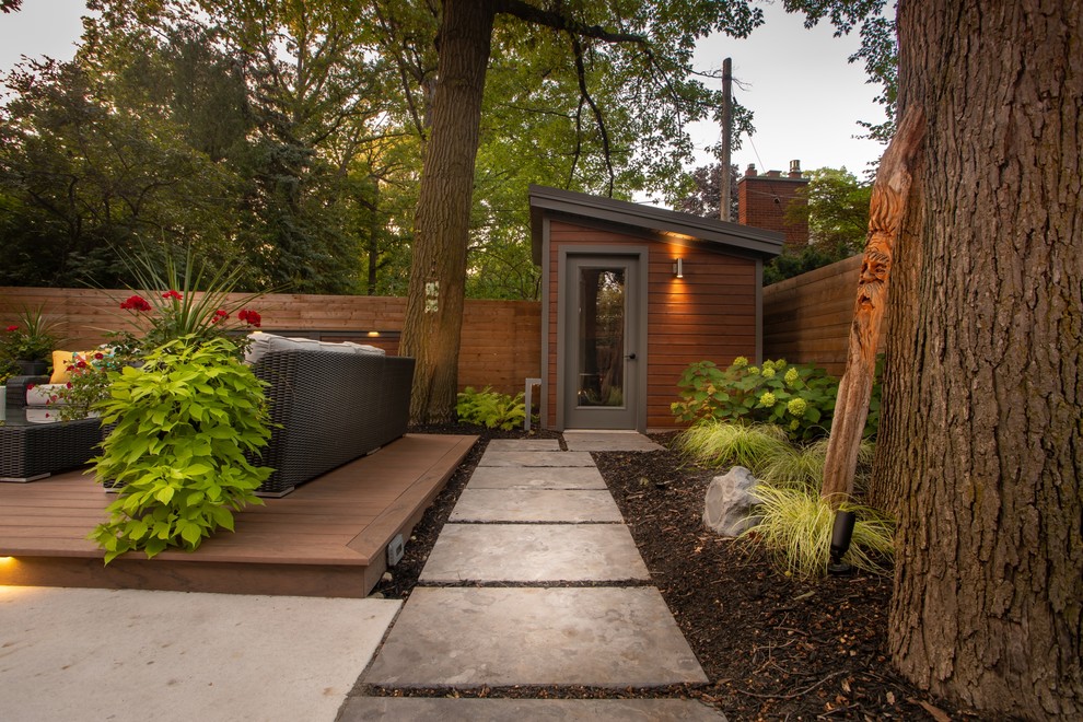 This is an example of a transitional backyard landscaping in Toronto.