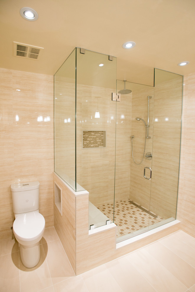 Photo of a large contemporary master bathroom in Toronto with a two-piece toilet, beige tile, porcelain tile, beige walls and porcelain floors.