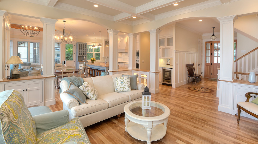Inspiration for a traditional open concept living room in Other with beige walls and coffered.