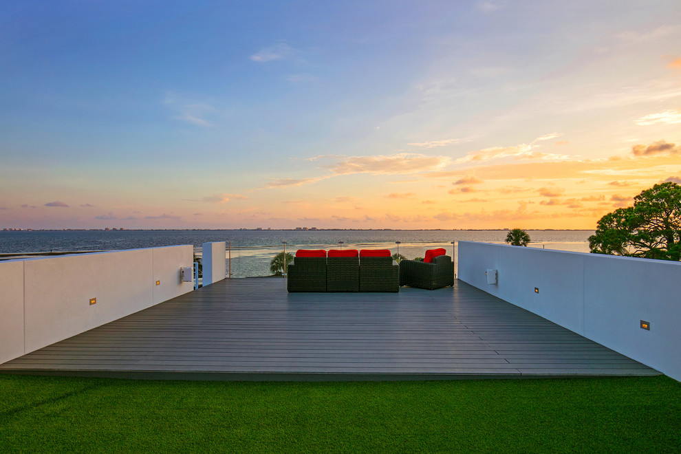 Inspiration for an expansive modern rooftop deck in Tampa with with dock and no cover.