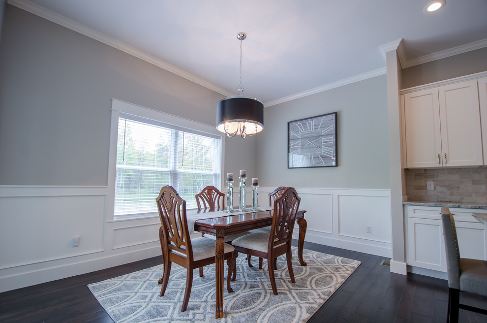Mid-sized transitional dark wood floor kitchen/dining room combo photo with gray walls