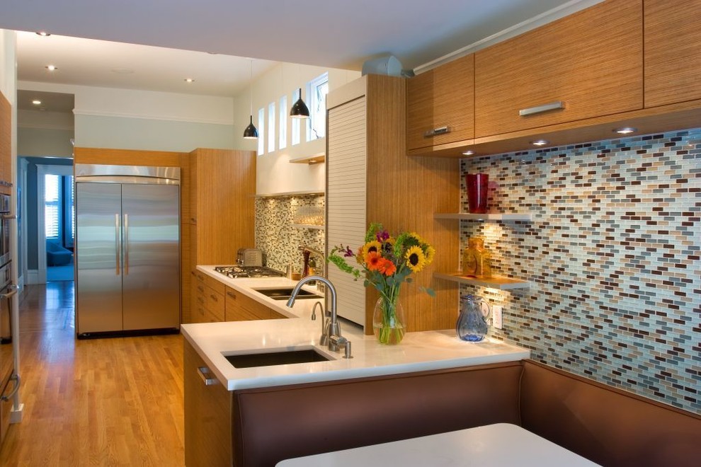 Inspiration for a contemporary l-shaped separate kitchen in San Francisco with glass tile splashback, stainless steel appliances, an undermount sink, flat-panel cabinets, medium wood cabinets and multi-coloured splashback.