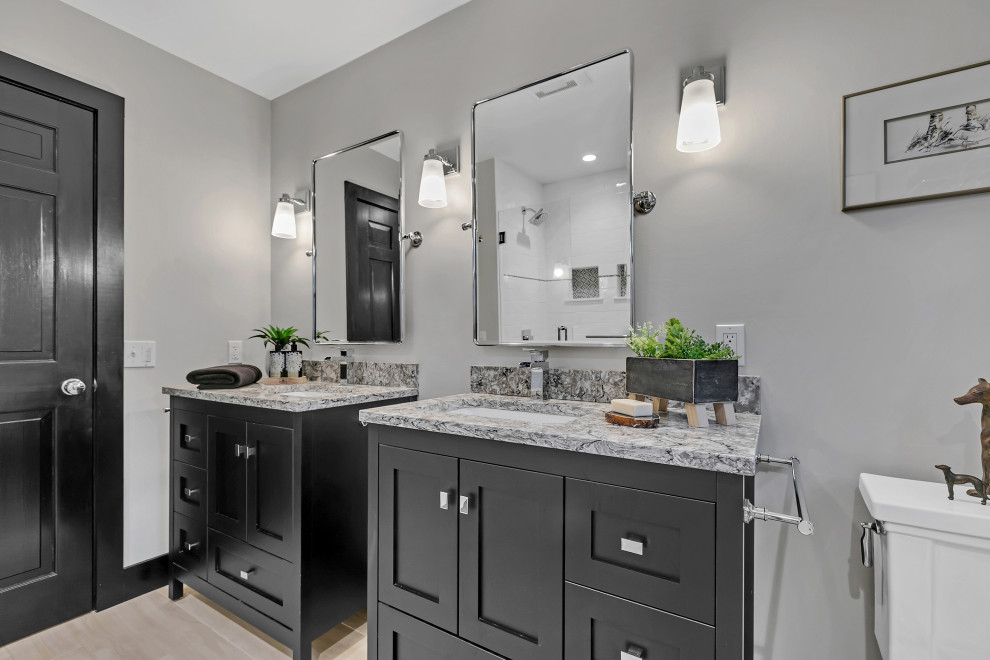 Example of a mid-sized transitional kids' white tile and subway tile wood-look tile floor, beige floor and single-sink bathroom design in New York with shaker cabinets, black cabinets, a two-piece toilet, gray walls, an undermount sink, quartz countertops, beige countertops, a niche and a freestanding vanity