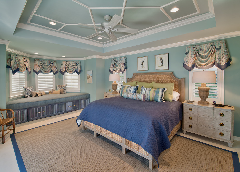 Photo of a mid-sized beach style guest bedroom in Miami with blue walls and carpet.
