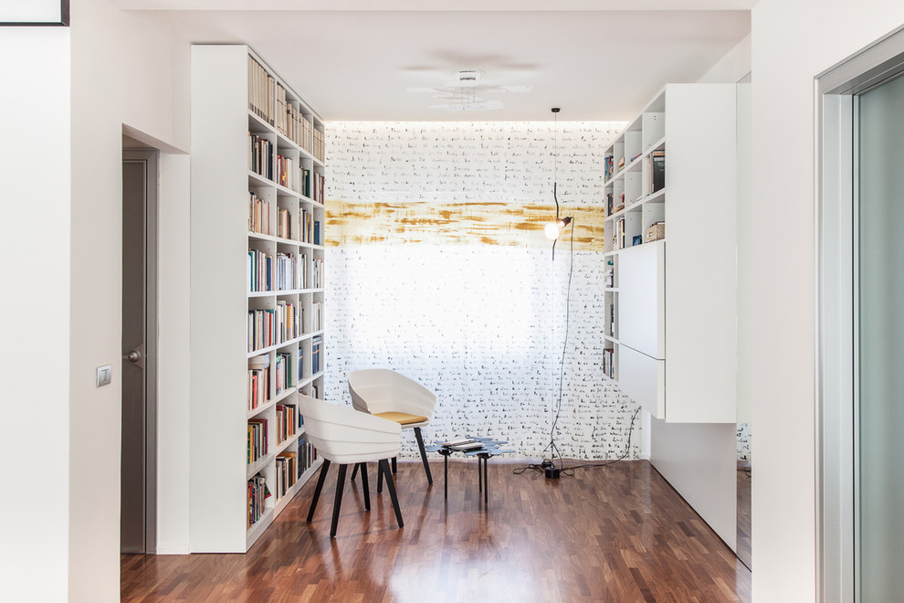 Photo of a small scandinavian open concept family room in Cagliari with a library and dark hardwood floors.