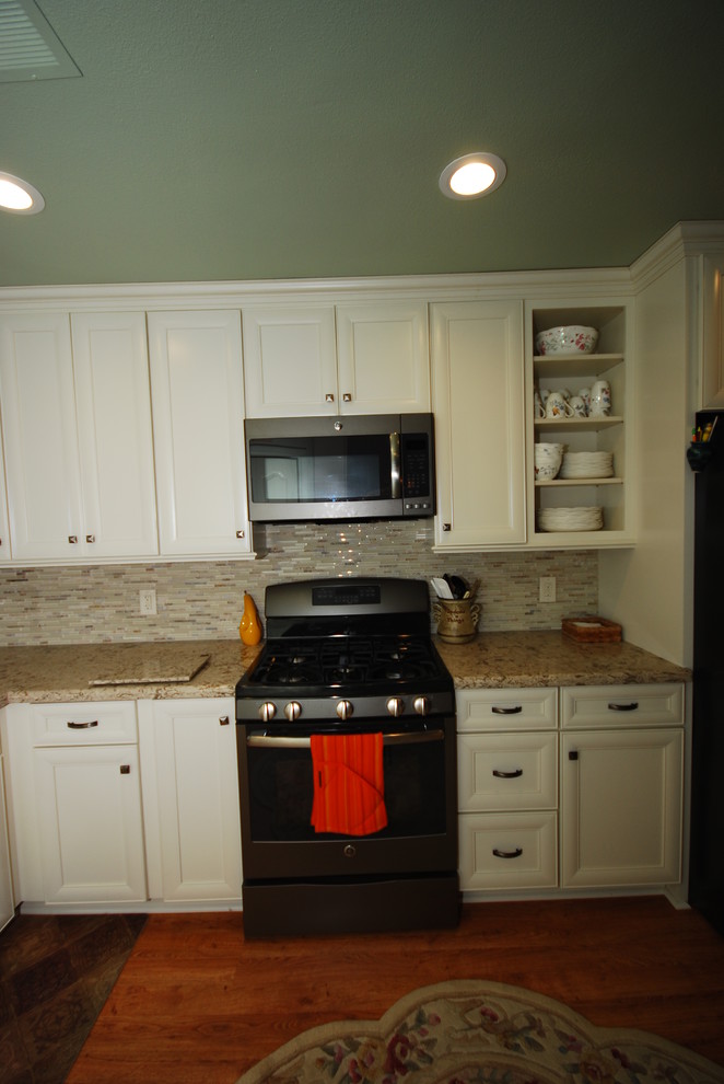 Inspiration for a transitional kitchen remodel with flat-panel cabinets and white cabinets