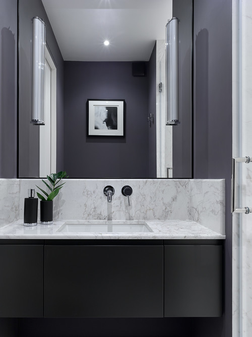 Luxurious Ambiance: Marble Slab Backsplash in Black Bathroom Vanity Ideas