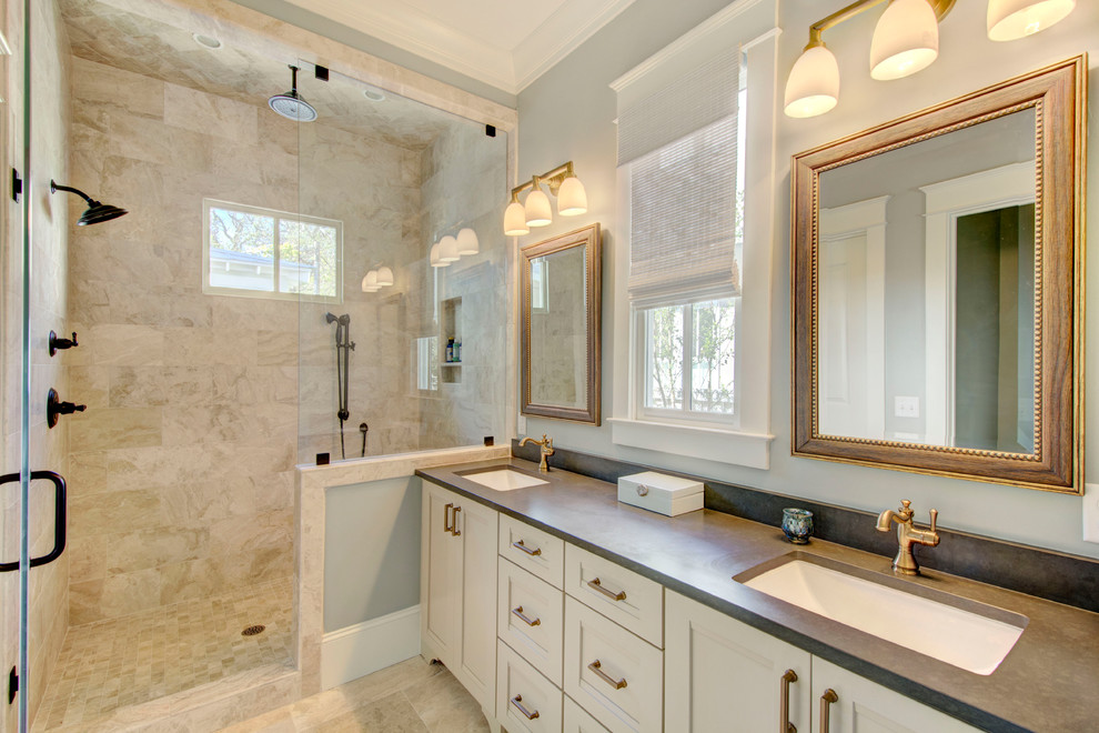 This is an example of a transitional master bathroom in Dallas with recessed-panel cabinets, beige cabinets, an alcove shower, beige tile, blue walls, an undermount sink, beige floor and a hinged shower door.
