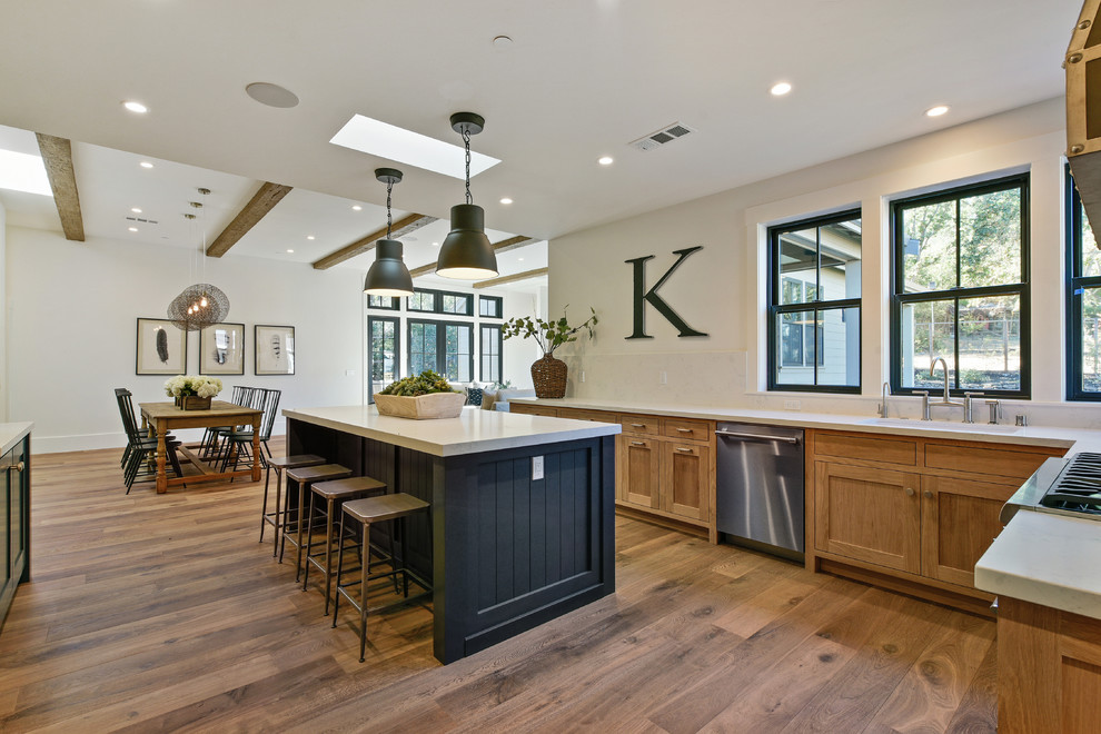 Transitional u-shaped kitchen in San Francisco with shaker cabinets and light wood cabinets.