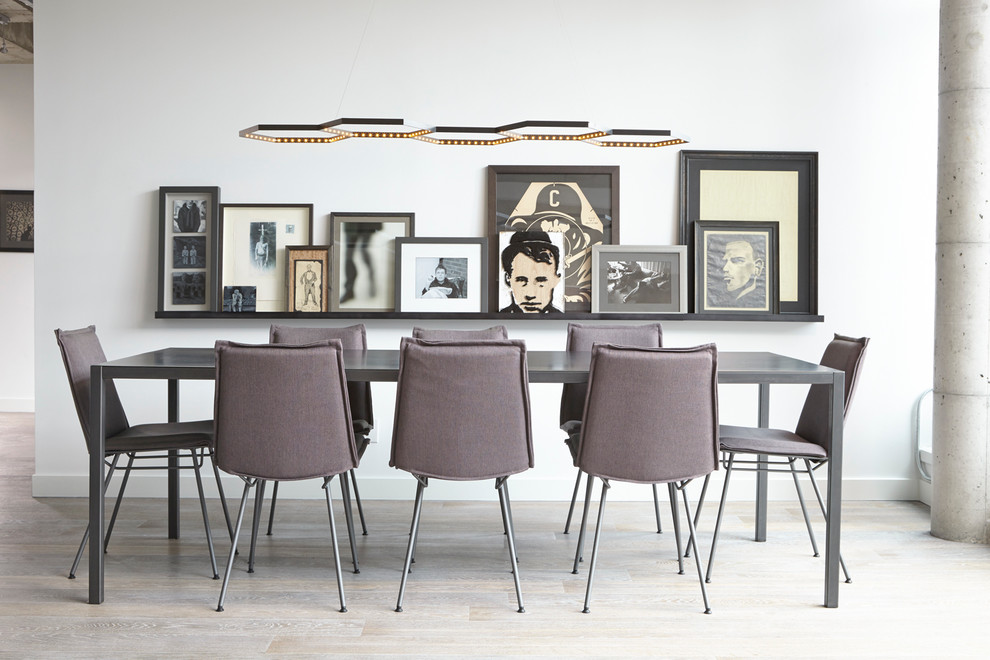 Dining room - contemporary light wood floor dining room idea in Toronto with white walls