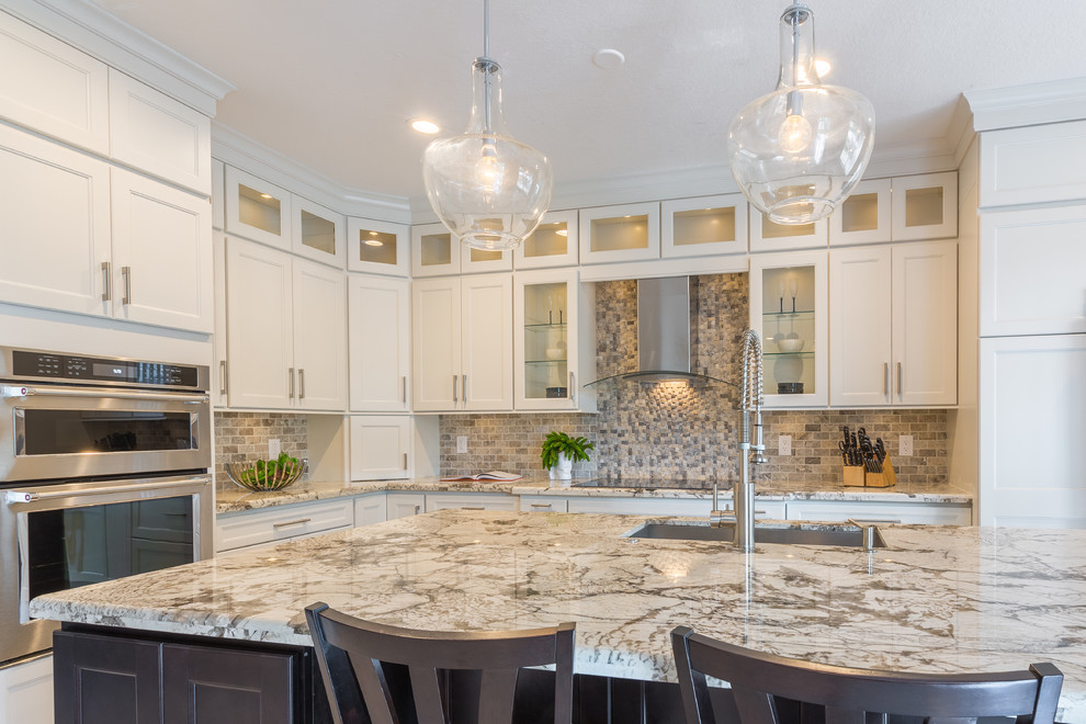 Design ideas for a large transitional l-shaped open plan kitchen in Miami with an undermount sink, flat-panel cabinets, white cabinets, quartzite benchtops, multi-coloured splashback and with island.