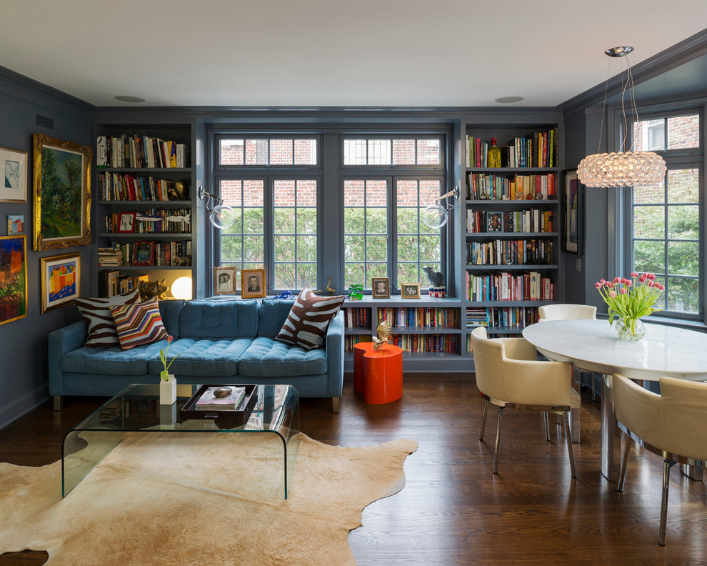 This is an example of a mid-sized contemporary open concept family room in New York with dark hardwood floors and grey walls.