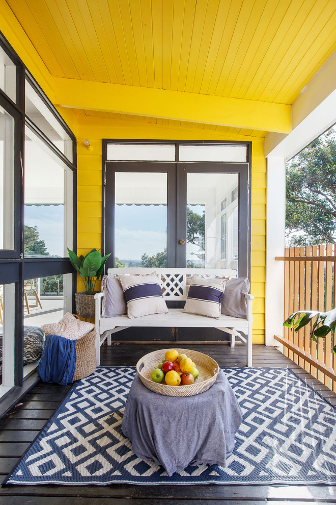 This is an example of a coastal porch design in Melbourne.