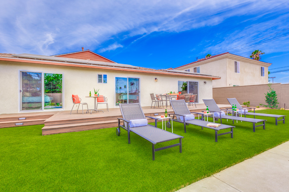 Example of a large transitional backyard concrete and rectangular lap hot tub design in Orange County