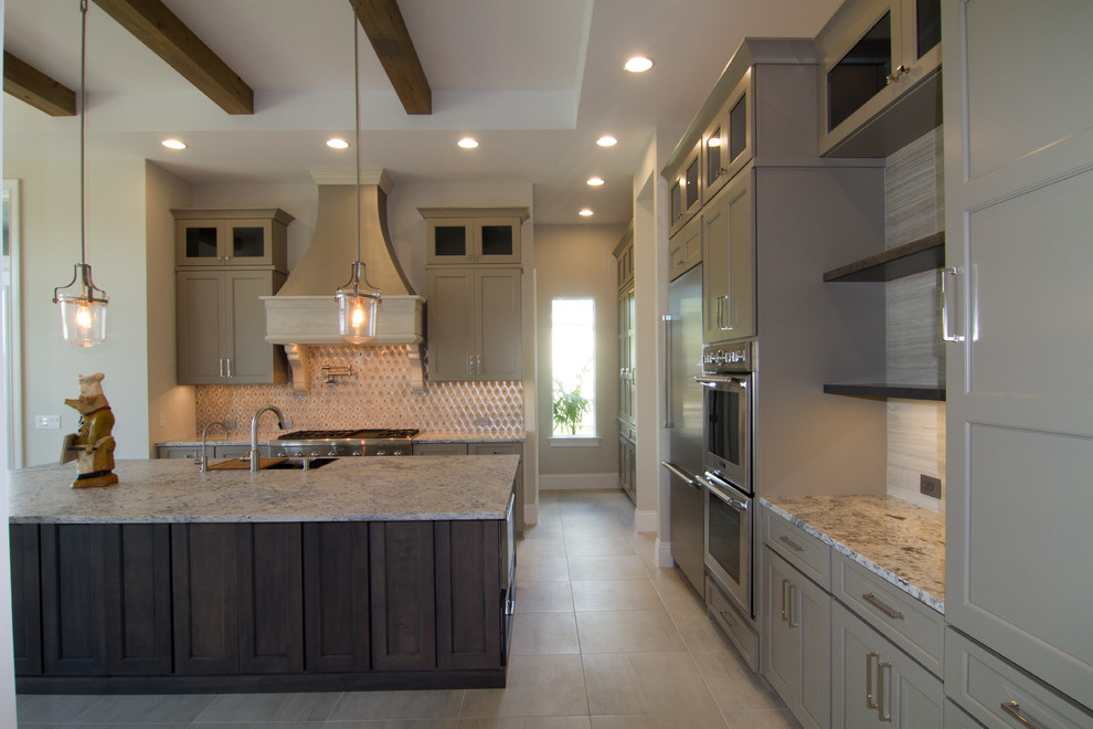 Inspiration for a large transitional l-shaped eat-in kitchen in Tampa with an undermount sink, shaker cabinets, grey cabinets, granite benchtops, multi-coloured splashback, ceramic splashback, stainless steel appliances, porcelain floors, with island and beige floor.