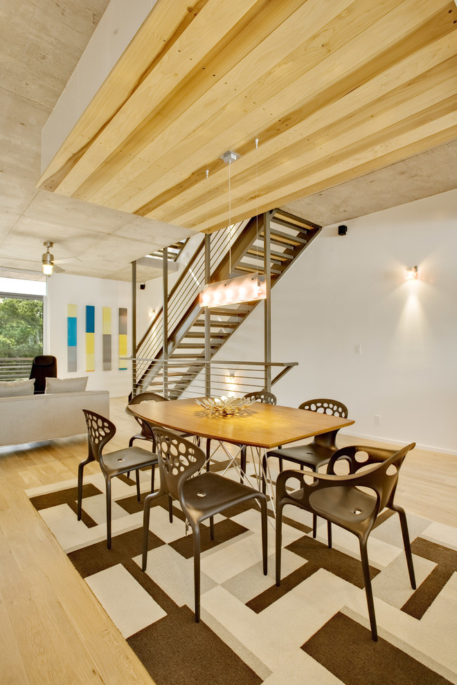 Photo of a modern dining room in Austin.