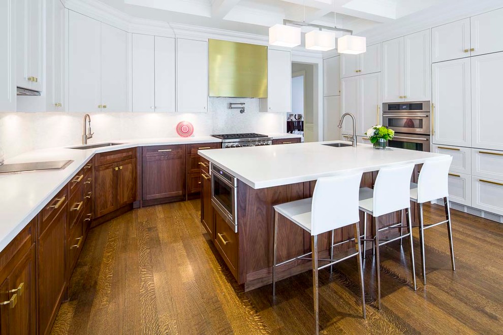 Design ideas for a large modern l-shaped eat-in kitchen in Toronto with an undermount sink, recessed-panel cabinets, medium wood cabinets, quartz benchtops, white splashback, mosaic tile splashback, stainless steel appliances, dark hardwood floors, with island and brown floor.
