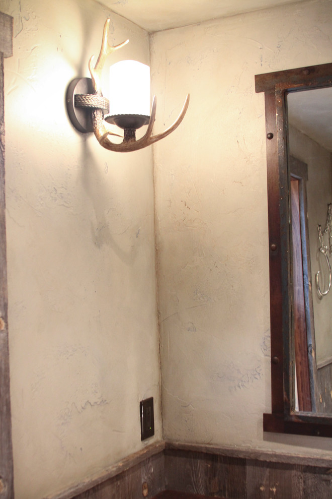 Example of a small mountain style 3/4 brown tile bathroom design with wood countertops and beige walls