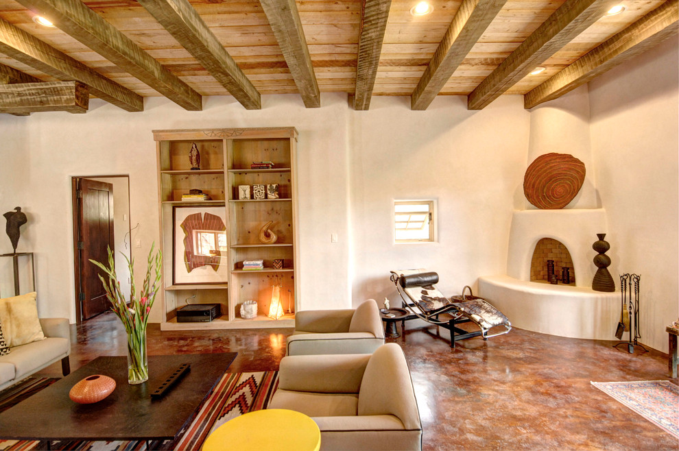 This is an example of a living room in Albuquerque with a corner fireplace and a plaster fireplace surround.
