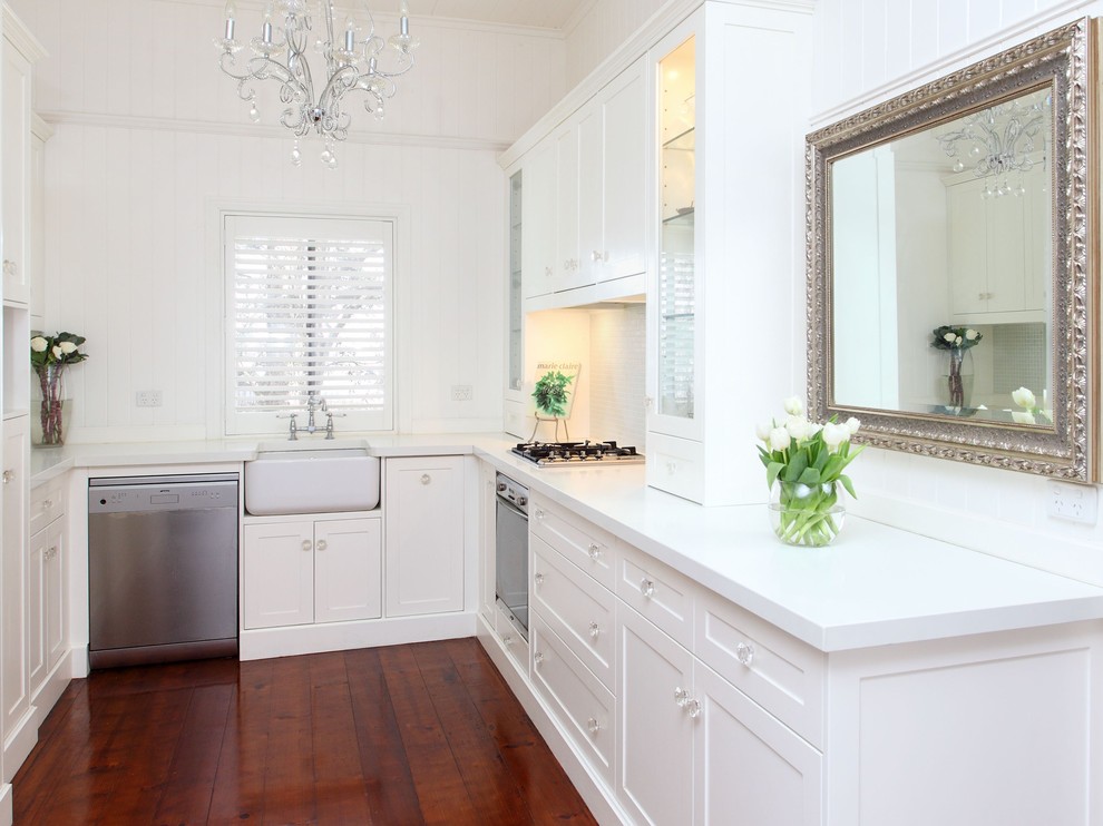This is an example of a traditional kitchen in Brisbane with a farmhouse sink and stainless steel appliances.