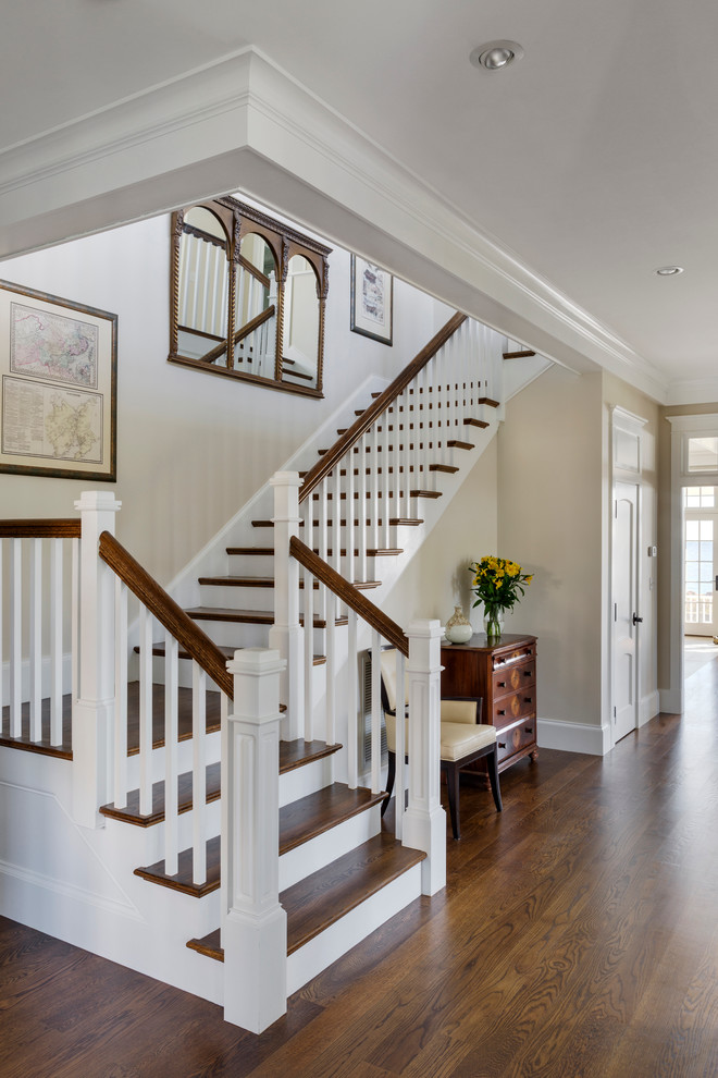 Inspiration for a large transitional wooden l-shaped staircase remodel in Boston with painted risers