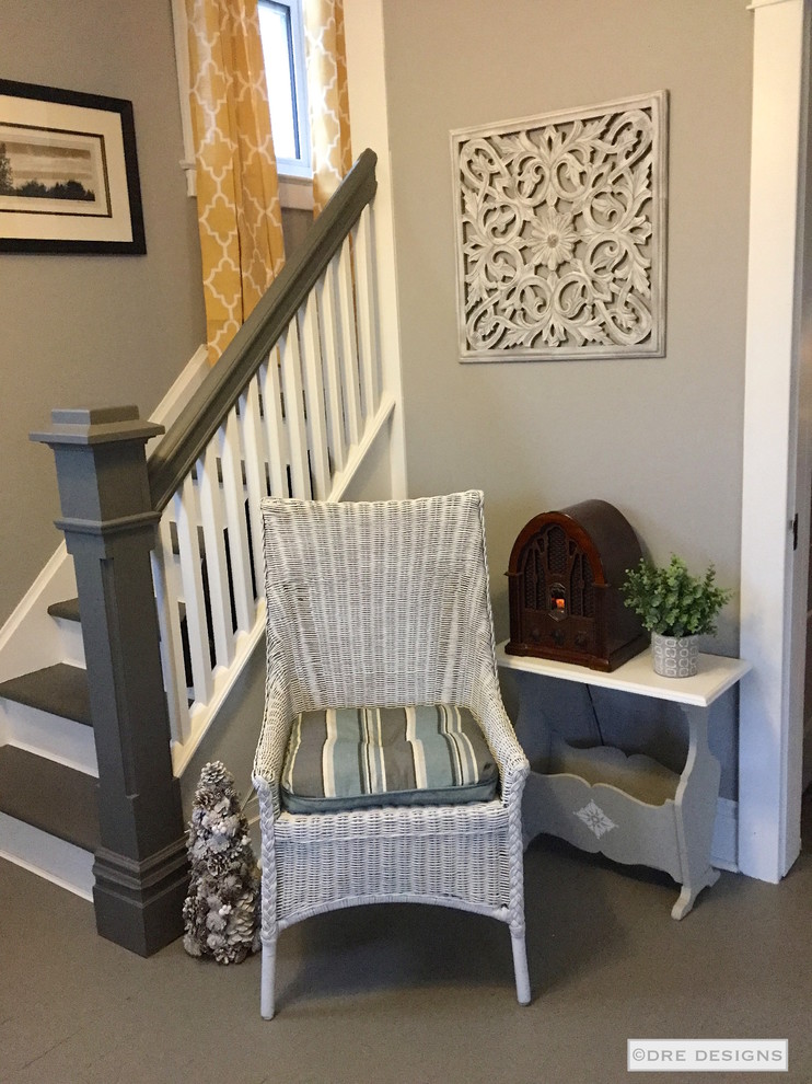 Inspiration for a large transitional painted wood floor foyer remodel in Toronto with gray walls and a gray front door