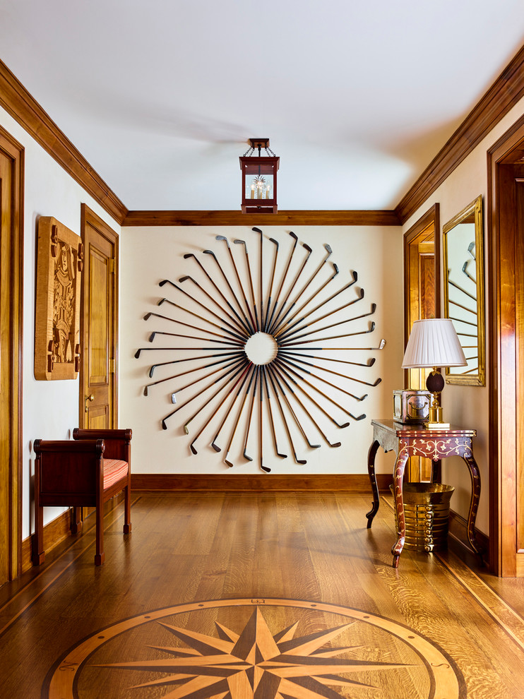 Design ideas for a traditional hallway in Huntington with beige walls, medium hardwood floors and brown floor.
