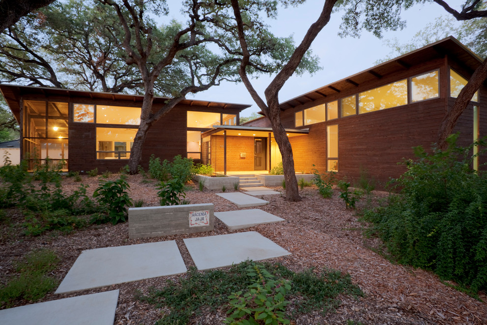 This is an example of a modern exterior in Austin with a shed roof.
