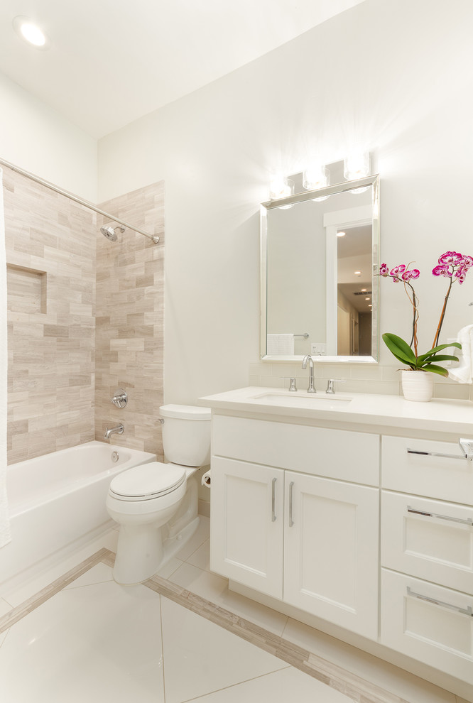 Mid-sized contemporary master bathroom in Sacramento with flat-panel cabinets, brown cabinets, a freestanding tub, an alcove shower, a one-piece toilet, white tile, ceramic tile, white walls, ceramic floors, an integrated sink, granite benchtops, white floor, a hinged shower door and blue benchtops.