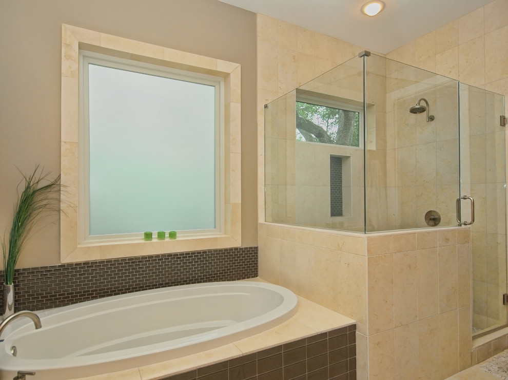 This is an example of a contemporary bathroom in Austin with an undermount sink, a drop-in tub and a corner shower.