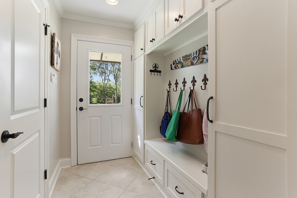 Inspiration for a transitional mudroom in New Orleans with white walls, ceramic floors, a single front door, a white front door and white floor.