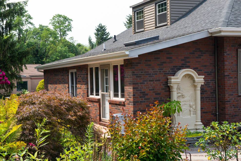 Inspiration for a small transitional backyard deck remodel with no cover